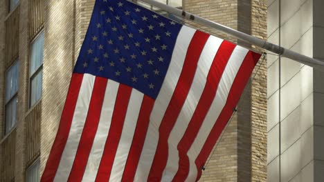 Close-Up-of-USA-Flag-Flying-on-Wall-Street