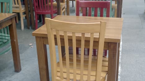 empty table and chairs at an outdoor cafe