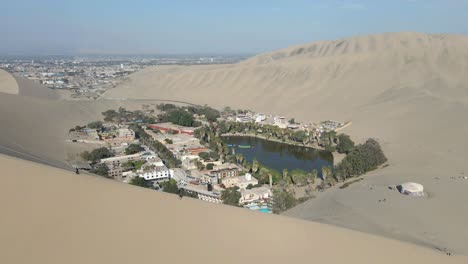 embark on a drone voyage approaching huacachina's oasis