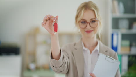 real estate agent holds keys to new developer apartment