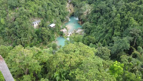 Static-aerial-long-shot-of-Kawasan-Falls-in-tropical-Jungle-of-Cebu,-Philippines