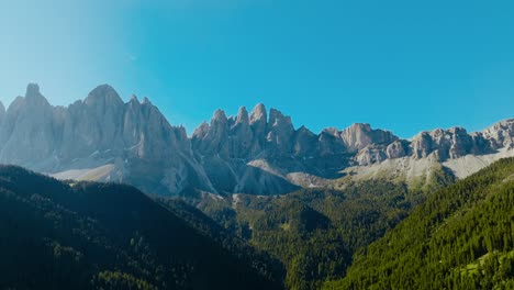 aerial drone shot of the dolomites with the forest and the alps, italy, dolomites