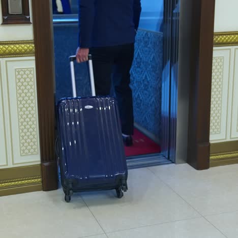 businessman near modern elevator
