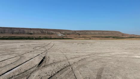 flying above the bottom of a dried lake to the foot of klementyev mountain