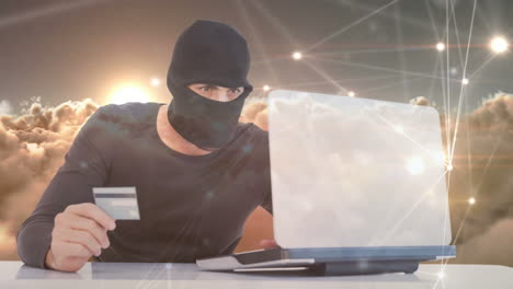 digital animation of hacker holding card while hacking the laptop 4k