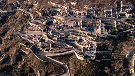 Aerial-view-of-Turkish-boutique-hotel-Kayakapi-Premium-Cave-hotel-in-Cappadocia,-Turkey