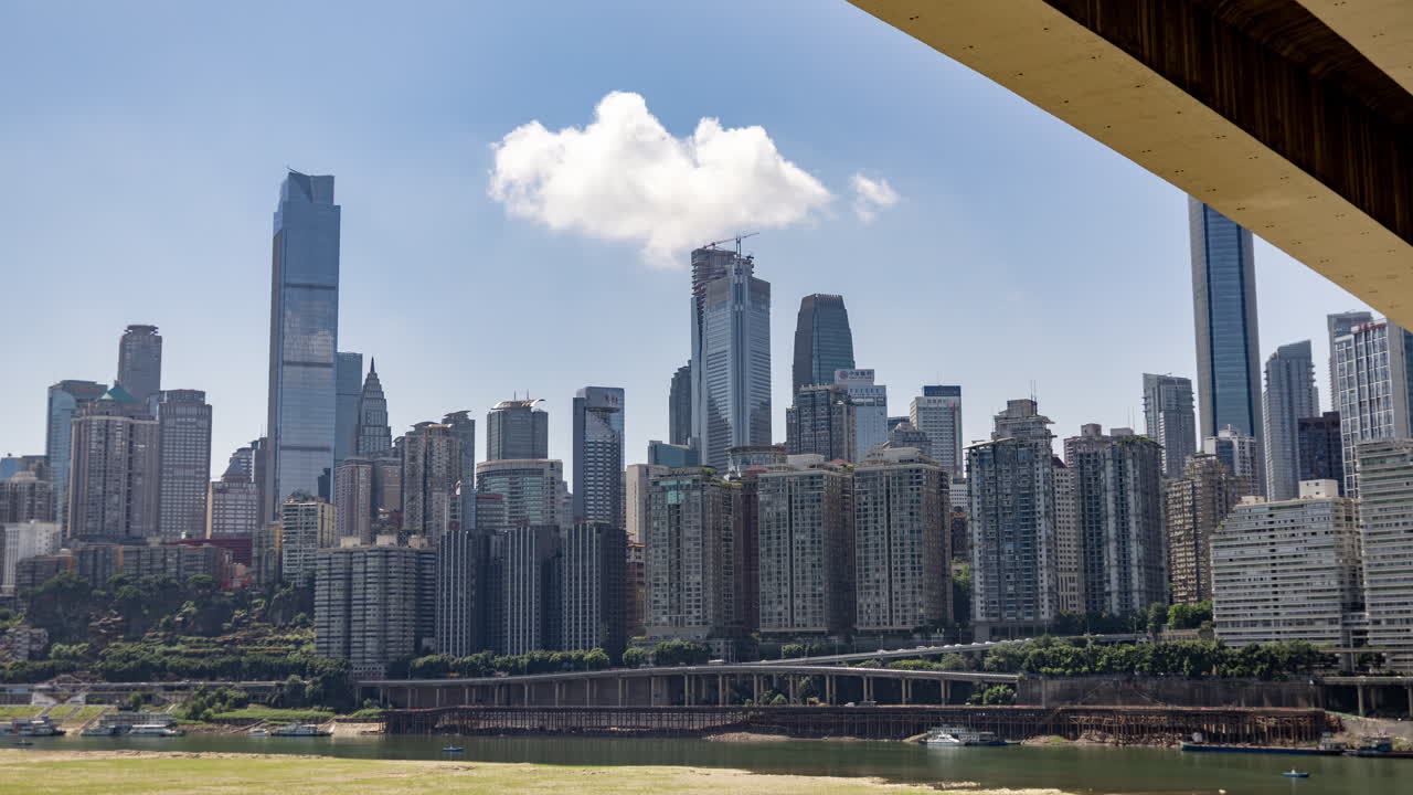 Timelapse of the amazing Chongqing cyberpunk city skyline from a high vantage point wirh the yangtze river