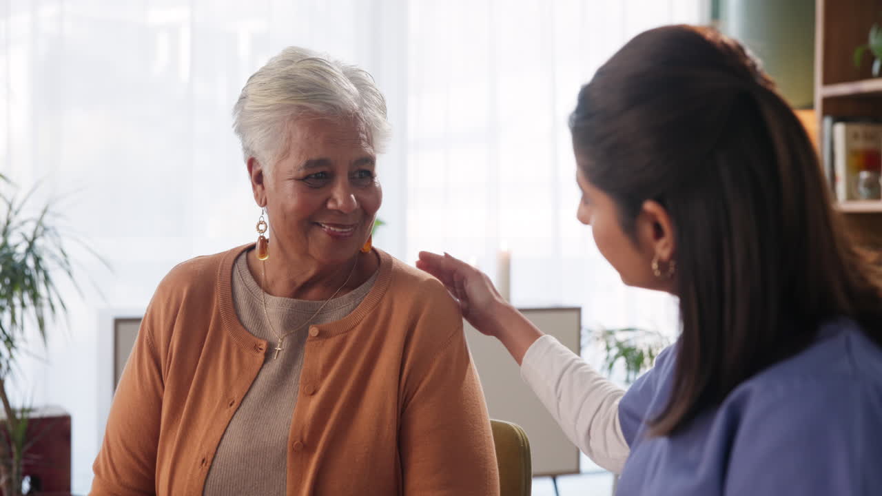 Elderly woman receiving care and support from caregiver