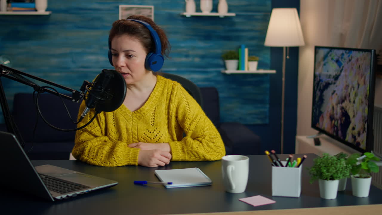 Vlogger on air during online show using laptop