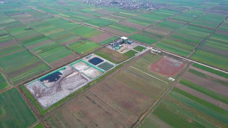 waste pile and polluted water of landfill and incinerator near agricultural parcels in albania