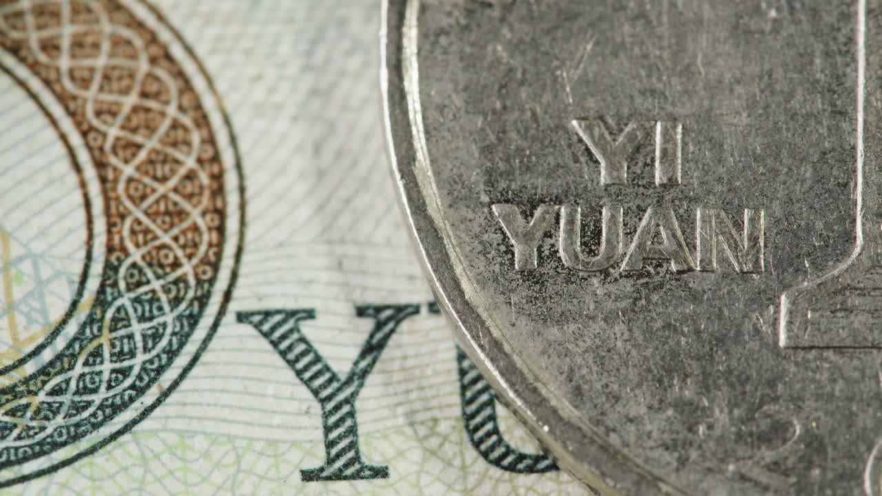 Close-up of Chinese Yuan Coin on Banknote