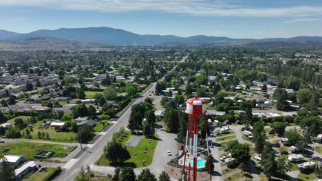 high up view of a water tower looming over its american neighborhood