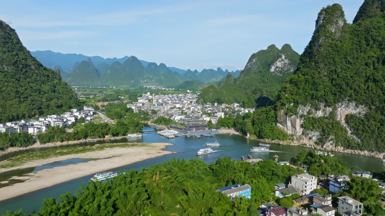 Aerial view of riverboats in front of the Xingping ancient town, summer in China