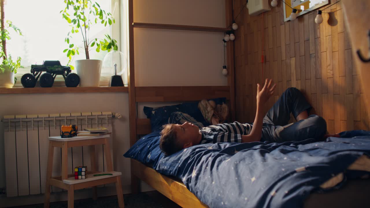 Boy playing in bedroom