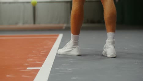 tennis player on indoor court