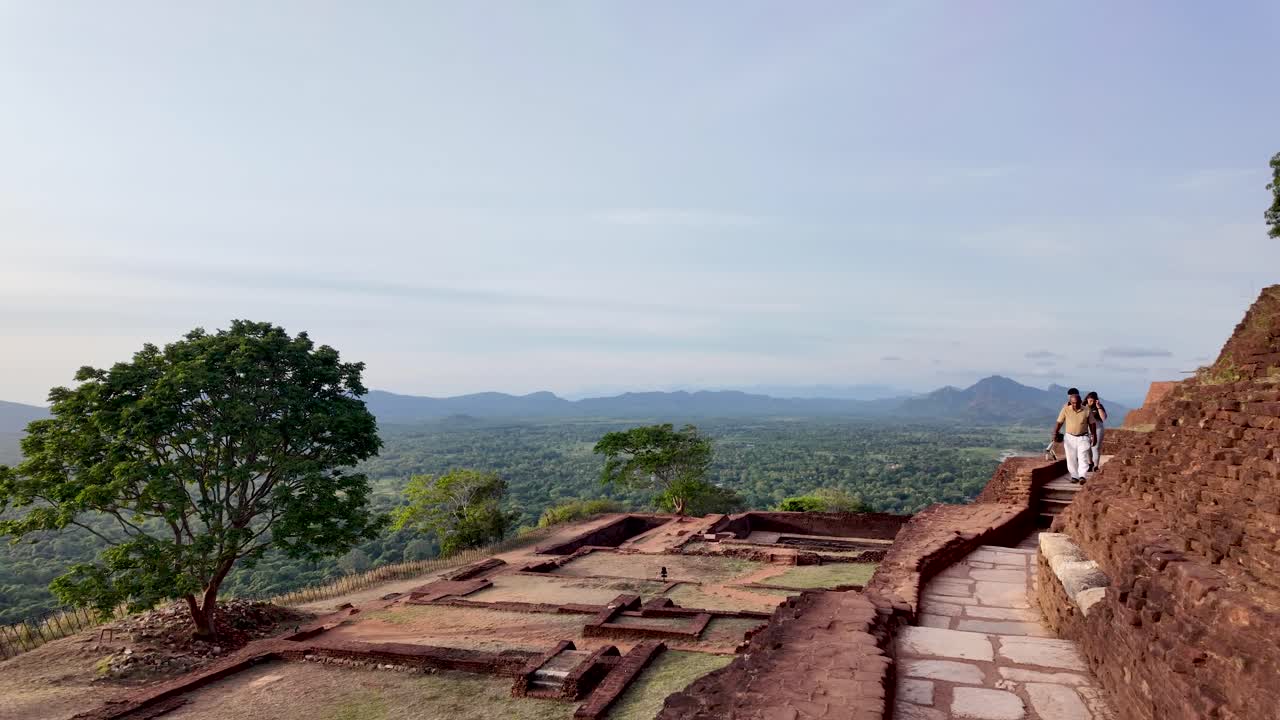 View from Sigiriya Rock in Sri Lanka, featuring ancient terraces and lush greenery. Ideal for exploring history and enjoying panoramic landscapes.