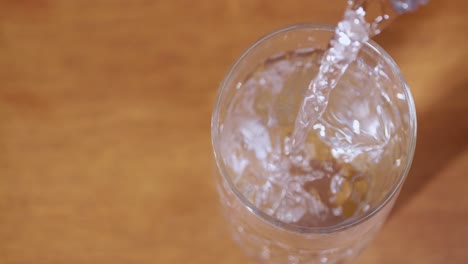 a close-up shot of water being poured into a glass highlighting the refreshing nature of hydration