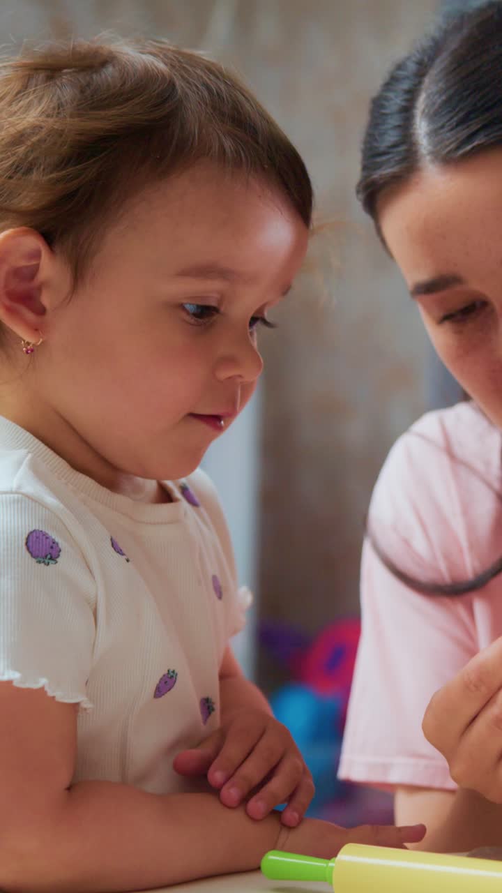 A Joyful Interaction Between a Child and an Adult: Crafting Moments of Connection and Creativity Through Playful Engagement with Colorful Toys