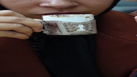 woman drinking turkish coffee with chocolate