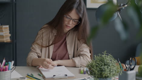 woman fashion designer working at desk