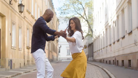 interracial couple dancing bachata in the old town street 4