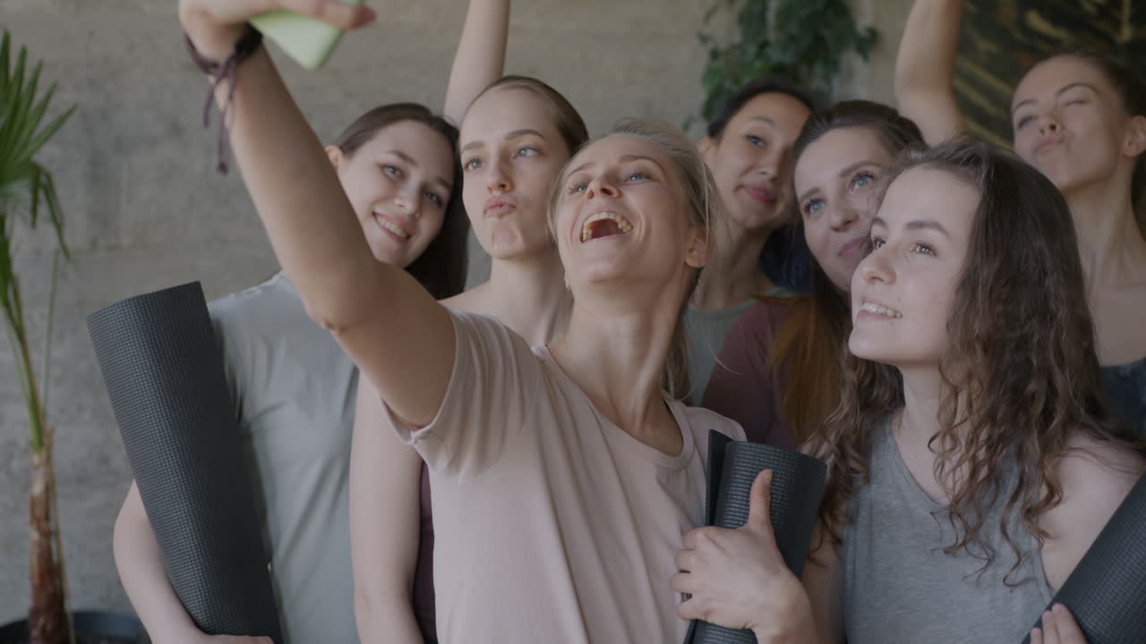 Happy Women Taking a Selfie in a Yoga Studio