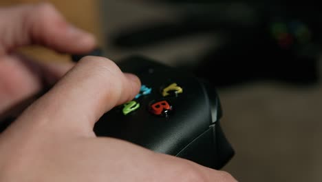 side close up of hands using video game controller