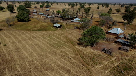 small village in africa during the hot and dry season - aerial view of a drought