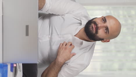 vertical video of home office worker man proud, money happiness.