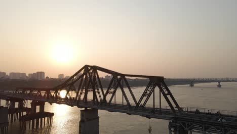 motorcycles run on long bien bridge - hanoi