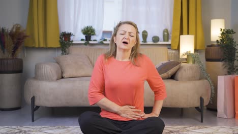 woman experiencing stomachache.