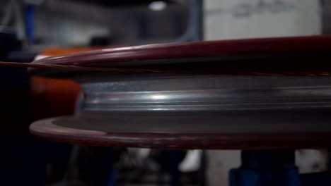 close-up of a copper wire drawn by the method of drawing in the factory equipment. manufacture of electric cable.