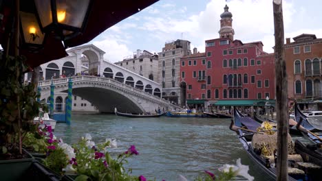 View-from-a-cafe-restaurant-on-the-water-to-the-Rialto-bridge-in-Venice-Italy