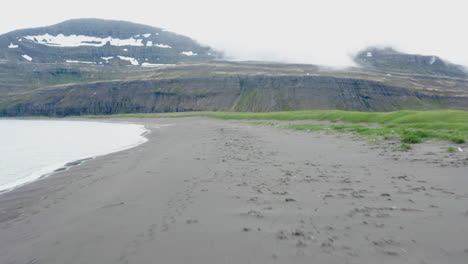 Cloud-covers-the-peaks-along-the-dramatic-barren-landscape-of-Hornvik-Bay-Iceland