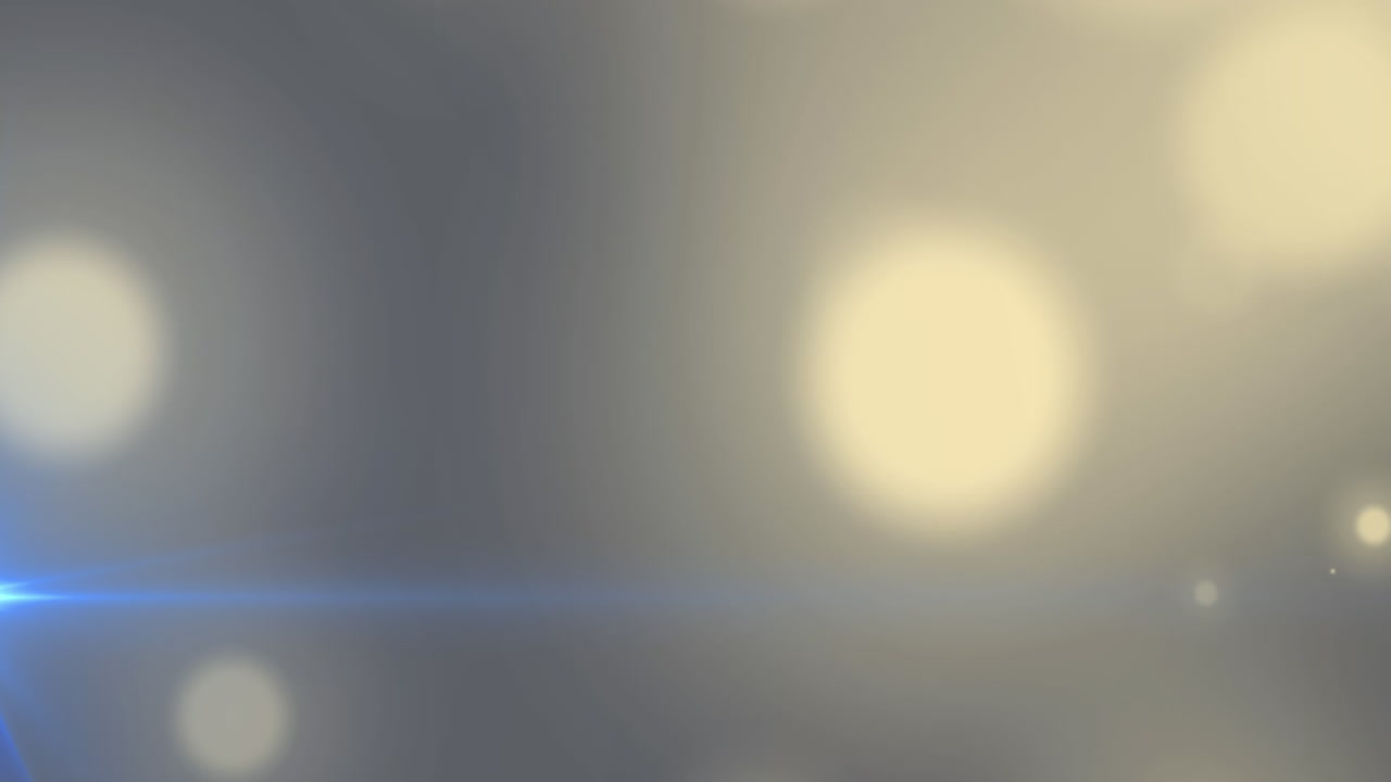 파란색 배경에 보케 빛의 노란색 반점의 디지털 애니메이션