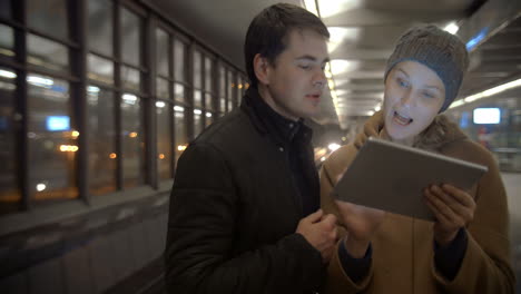 Couple-Planning-Their-Evening-with-Tablet-PC