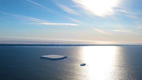 antarctic ice shelf and tabular iceberg seen from a helicopter