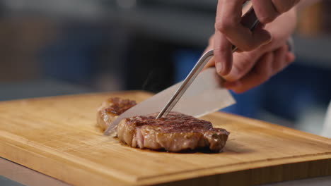 cutting steak in pieces
