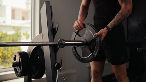 man lifting weights in the gym