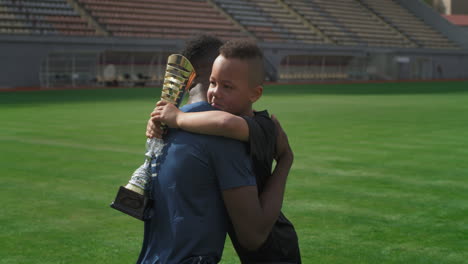 proud father and son celebrating victory