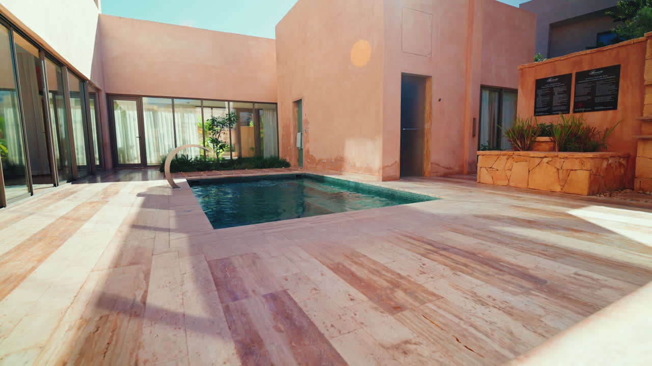 Indoor swimming pool inside luxury Moroccan villa.