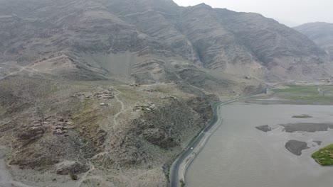 the road adorning river and peaks