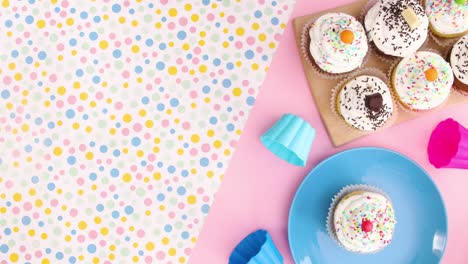 birthday party decoration with muffins cup cakes on the plate. stop motion