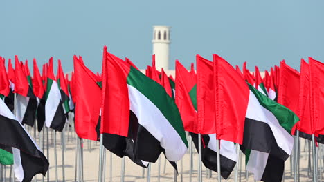 Las-Banderas-De-Los-Emiratos-Árabes-Unidos-Se-Exhiben-En-El-Jardín-De-Banderas-Para-Celebrar-El-Día-De-La-Bandera-De-Los-Emiratos-Árabes-Unidos-En-Dubai,-Emiratos-Árabes-Unidos.