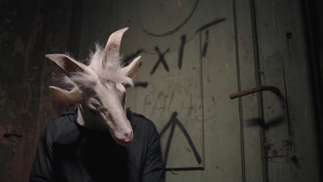 goat mask in a dark alley