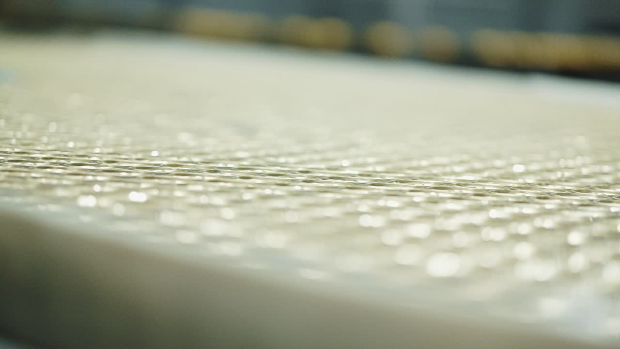 Thousands of beverage cans moving along the production line of a factory