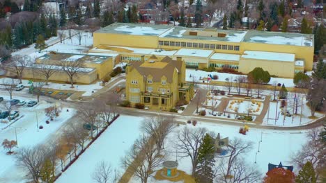 aerial winter semi circle around the quiet government house with the old royal alberta museum designated by her majesty queen elizabeth ii on may 24th 2005 in celebration of alberta's centennial 2-6