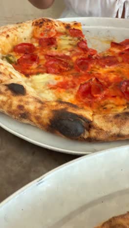 close-up of pepperoni pizza and other italian dishes
