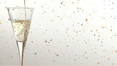 Animation-of-confetti-falling-over-champagne-glass-on-white-background