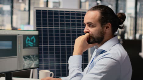 renewable energy researcher using simulation software, improving green industry